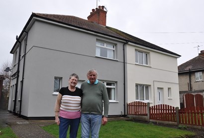 Two Bassetlaw residents outside of their home
