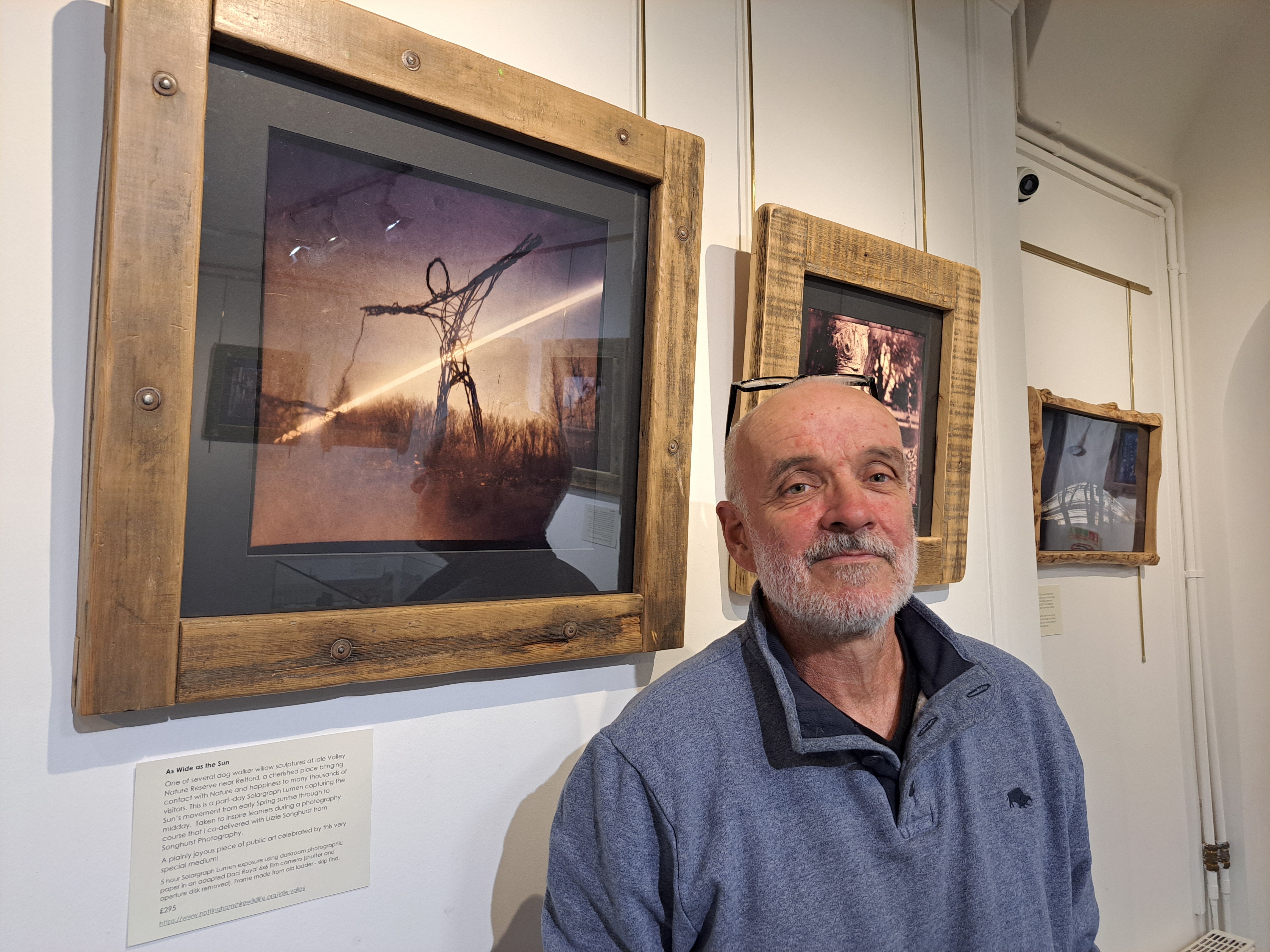 Alan Withington with artwork part of the ‘The Invisible Light’ exhibition.