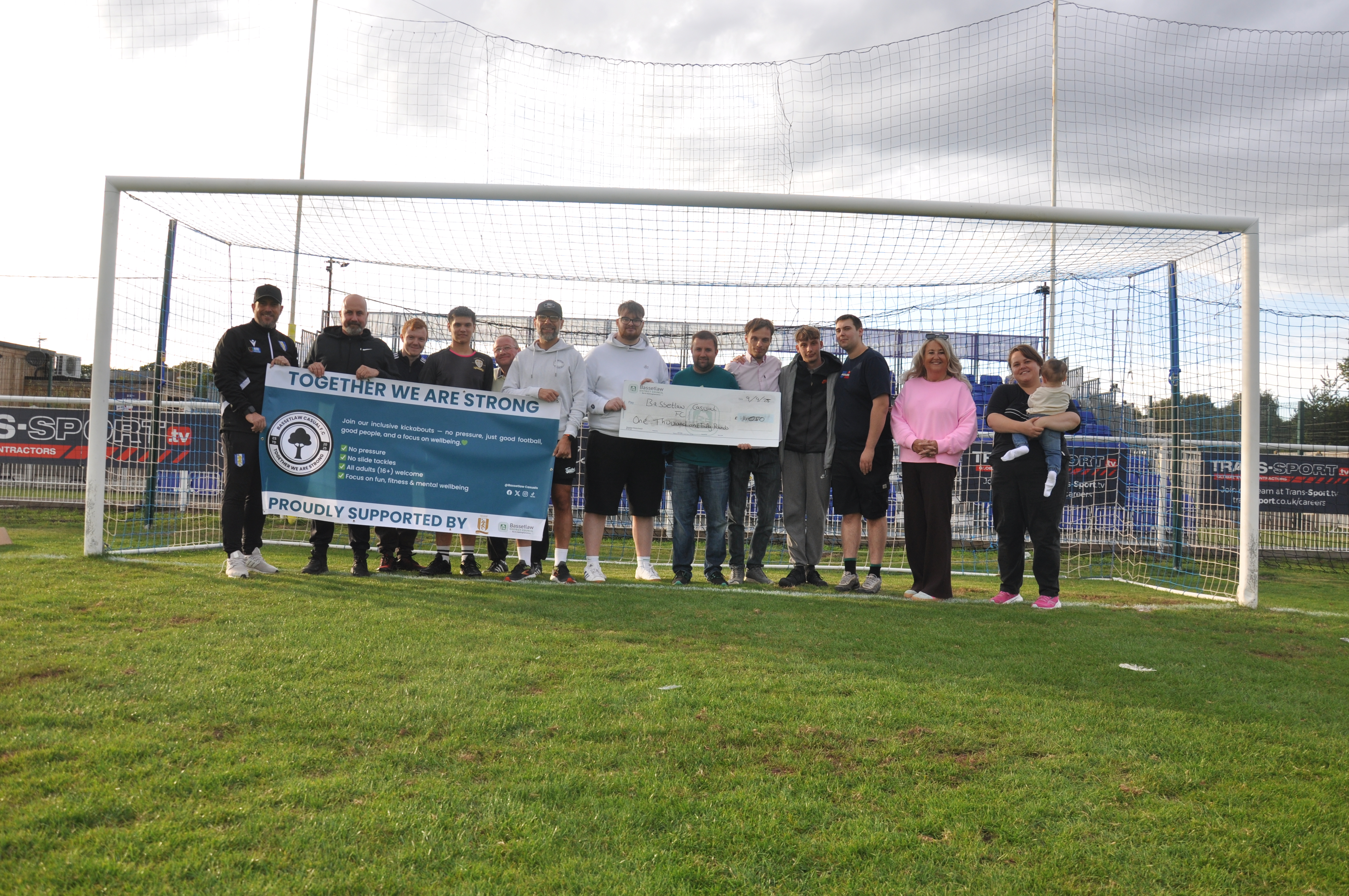 Chris Woodhead, Brett Roberts, Cllrs Challinor, Shaw, and Digby, and Members of Bassetlaw Casual FC.