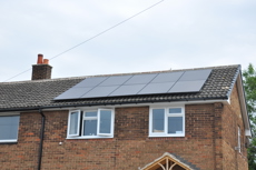 Solar panels on the roof at the front of a house.